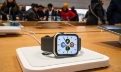 An Apple smartwatch is displayed as customers visit the Apple store in New York, 26 December 2023. Photograph: Eduardo Muñoz/Reuters