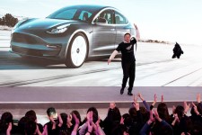 Elon Musk dancing in 2020 as his company, Tesla, unveiled the first cars made at its factory in Shanghai. Credit...Aly Song/Reuters