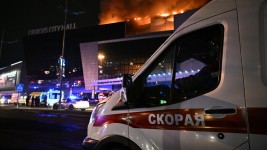 An ambulance at the Crocus City Hall concert hall, where the shooting occurred. ©  Sputnik/Sergey Bobylev