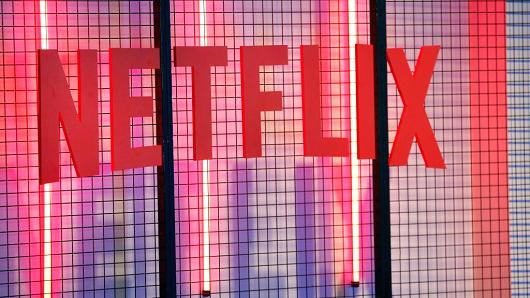 Chesnot | Getty Images /Sky, the European pay-TV group at the centre of a fierce takeover battle, said it would add online video service Netflix to a new TV bundle, brin The Netflix logo is displayed during trade fair Paris Games Week on October 31