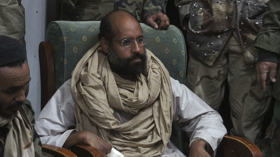 FILE PHOTO: Saif al-Islam Gaddafi in the custody of rebel fighters in Obari, Libya. November 19, 2011. © Ammar El-Darwish / Reuters