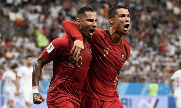 Ricardo Quaresma celebrates scoring Portugal’s opening goal against Iran with Cristiano Ronaldo, who later had a penalty saved. Photograph: Filippo Monteforte/AFP/Getty Images