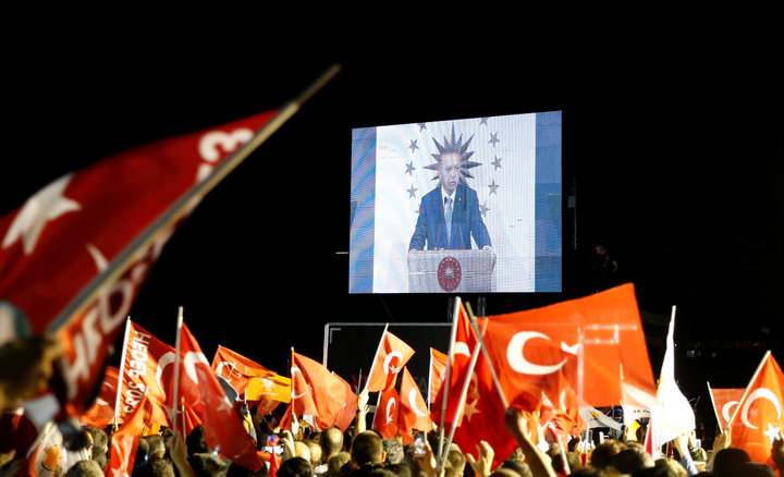 ALKIS KONSTANTINIDIS / REUTERS Turkish President Tayyip Erdogan is seen on the screen as he addresses his supporters in Istanbul, Turkey.