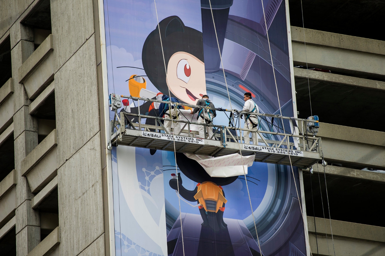 A GitHub billboard being installed in San Francisco in 2014. Microsoft said on Monday that it would acquire the company for $7.5 billion.CreditDavid Paul Morris/Bloomberg