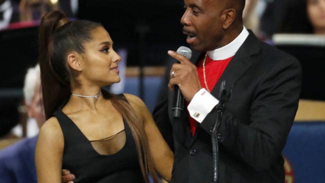 Bishop Charles H. Ellis, III, right, with Ariana Grande after she performed during the funeral service for Aretha Franklin in Detroit. Picture: AP Photo/Paul SancyaSource:AP