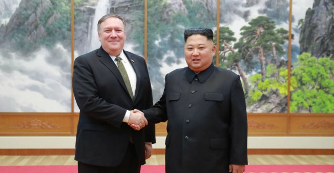 © KCNA via KNS / AFP | North Korea's Kim Jong Un (right) shakes hands with US Secretary of State Mike Pompeo at the Paekhwawon State Guesthouse in Pyongyang on October 7, 2018.