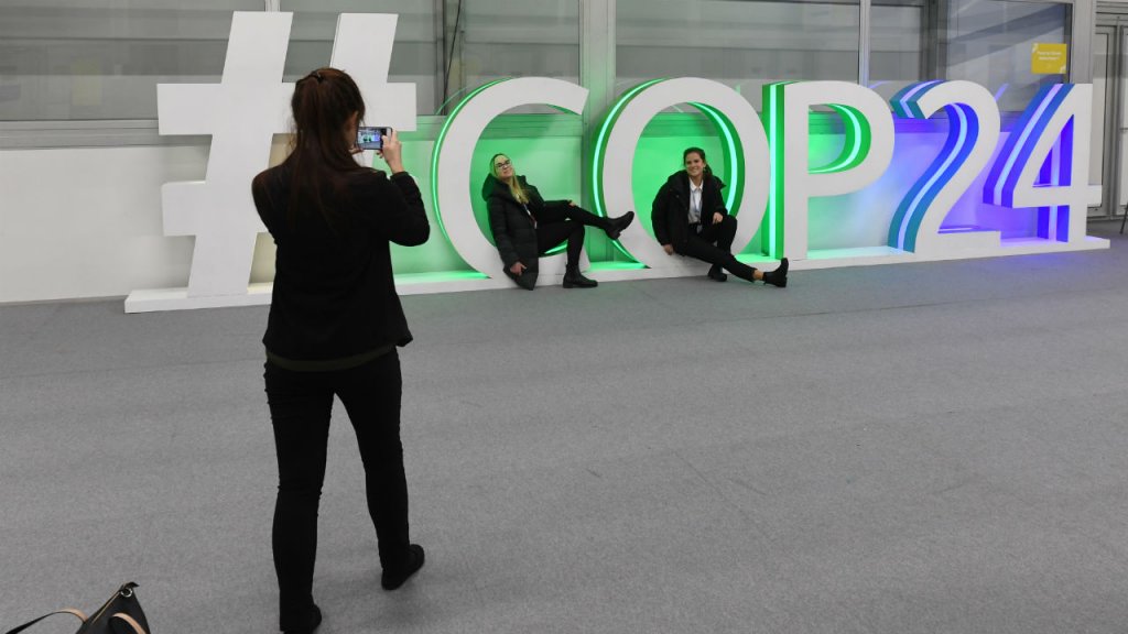 Janek Skarzynski, AFP | Participants pose for a picture during the final session of the COP24 summit on climate change in Katowice, Poland, on December 14, 2018.