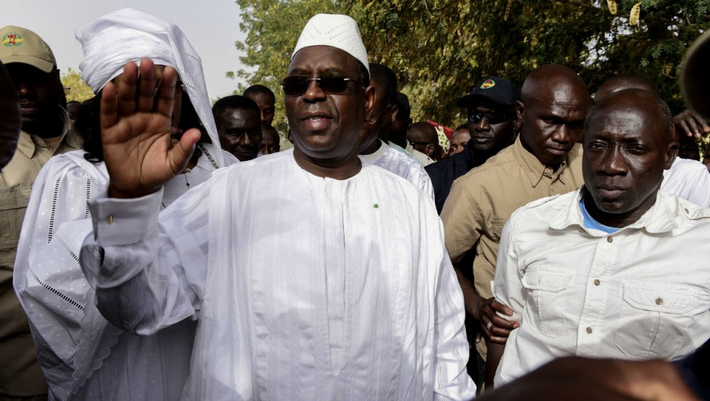 Seyllou, AFP | Incumbent President Macky Sall waves to supporters after casting his vote for Senegal's presidential elections at a polling station in Fatick on February 24, 2019