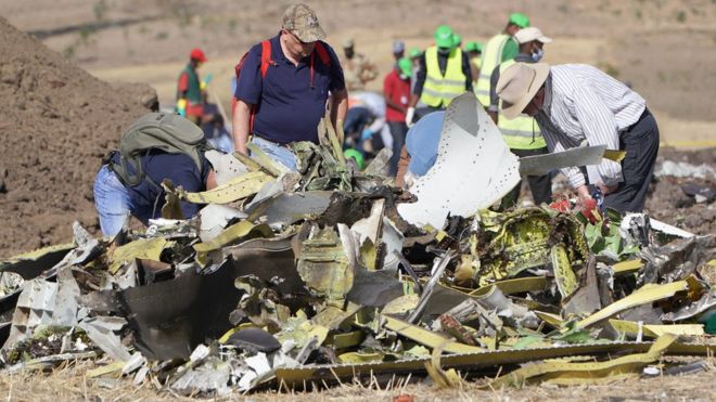 GETTY IMAGES / Investigators examine wreckage from the Ethiopian Airlines plane crash