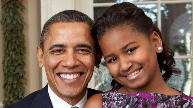 President Barack Obama with his youngest daughter Sasha, who is now all grown up at age 17 and attending her prom.Source:Supplied