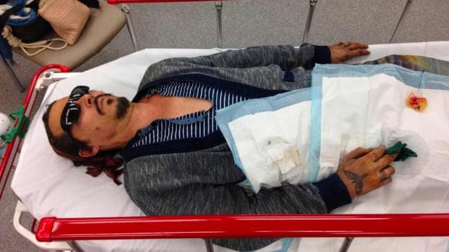 A new photo has emerged from 2015 of Johnny Depp on a hospital stretcher in Australia. Picture: The Blast.com/MEGASource:Mega