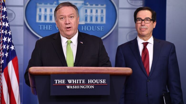 U.S. Secretary of State Mike Pompeo and Treasury Secretary Steven Mnuchin announced new sanctions on Iran, at the White House on Friday. (Nicholas Kamm/AFP/Getty Images)