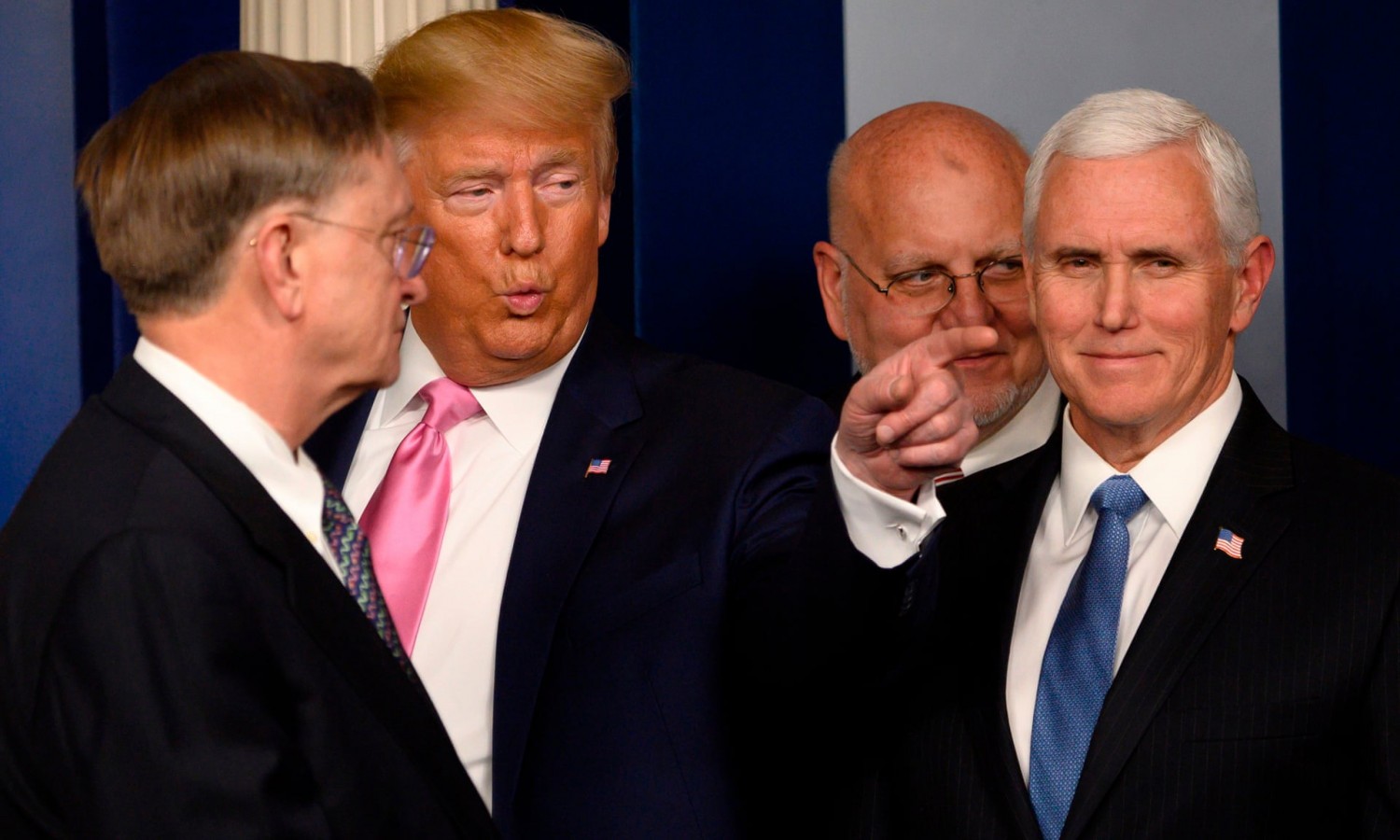 US President Donald Trump (2nd L) flanked by US Vice President Mike Pence (R), after speaking at a news conference on the COVID-19 outbreak at the White House on February 26. Photograph: Andrew Caballero-Reynolds/AFP via Getty 