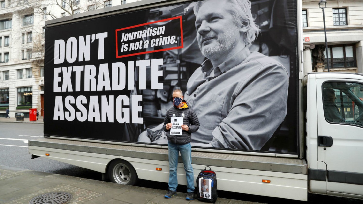 A supporter of WikiLeaks founder Julian Assange demonstrates against his extradition in London on February 22, 2020. © Peter Nicholls, REUTERS