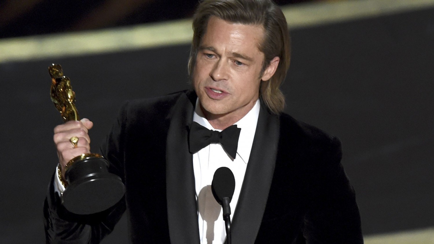 Brad Pitt accepts the award for best performance by an actor in a supporting role for 'Once Upon a Time in Hollywood' at the Oscars on Sunday, Feb. 9, 2020, at the Dolby Theatre in Los Angeles. (AP Photo/Chris Pizzello)