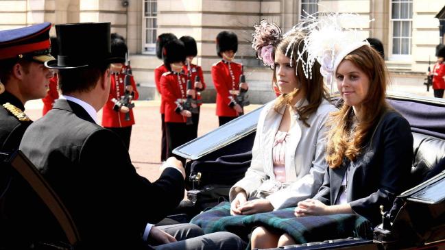 Prince Harry (L) sits in a carriage with the Duke of York (2nd L) and his daughters Princess' Eugenie and Beatrice (R) as they leave Buckingham Palace, in London, 17 June 2006 to watch the annual Trooping the Colour ceremony a