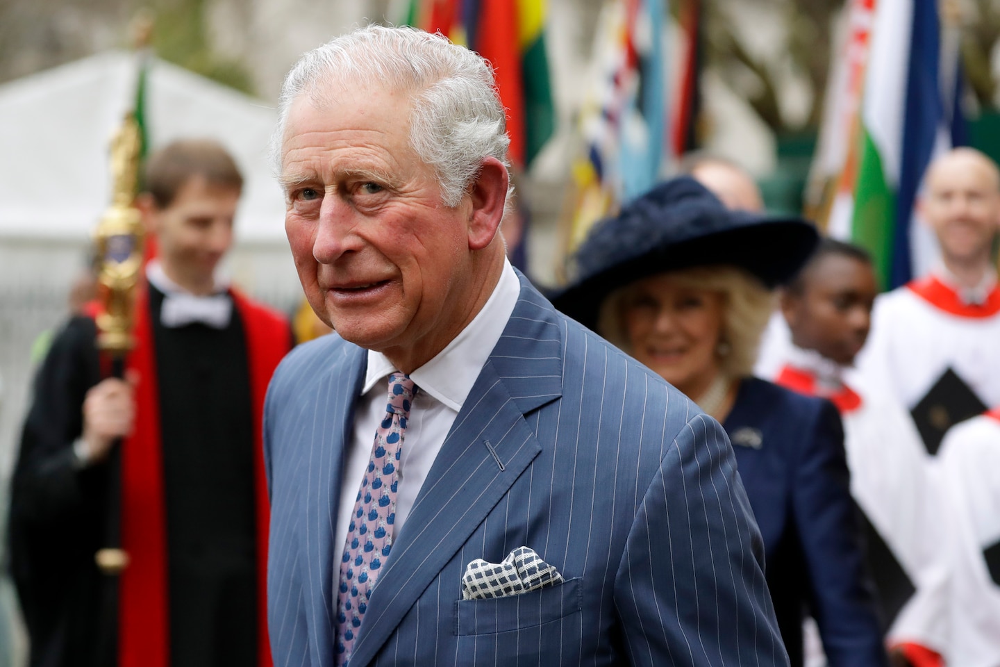 In this March 9, 2020 photo, Britain's Prince Charles and Camilla the Duchess of Cornwall, in the background, leave after attending the annual Commonwealth Day service at Westminster Abbey in London, Monday, March 9, 2020. (Kirsty Wigglesworth&#x