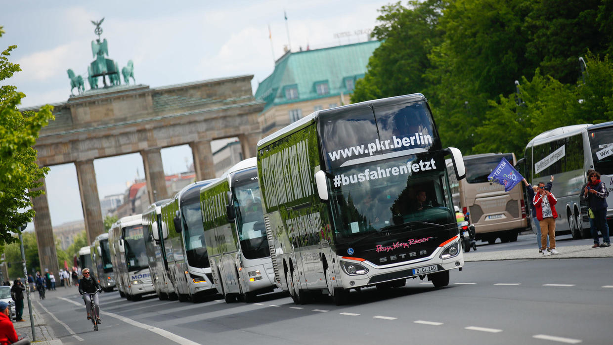 Tourism industry workers demonstrate with a bus parade demanding financial help from the German government in Berlin, Germany, on May 13, 2020. Tourism industry workers demonstrate with a bus parade demanding financial help from the German government in B