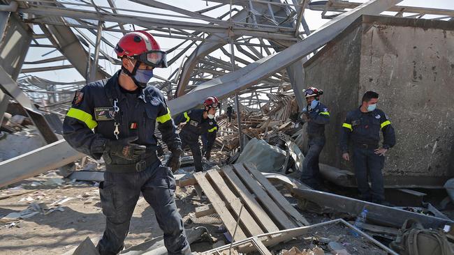 French rescue workers search through the rubble in the devastated Beirut port. Picture: JOSEPH EID / AFP.Source:AFP