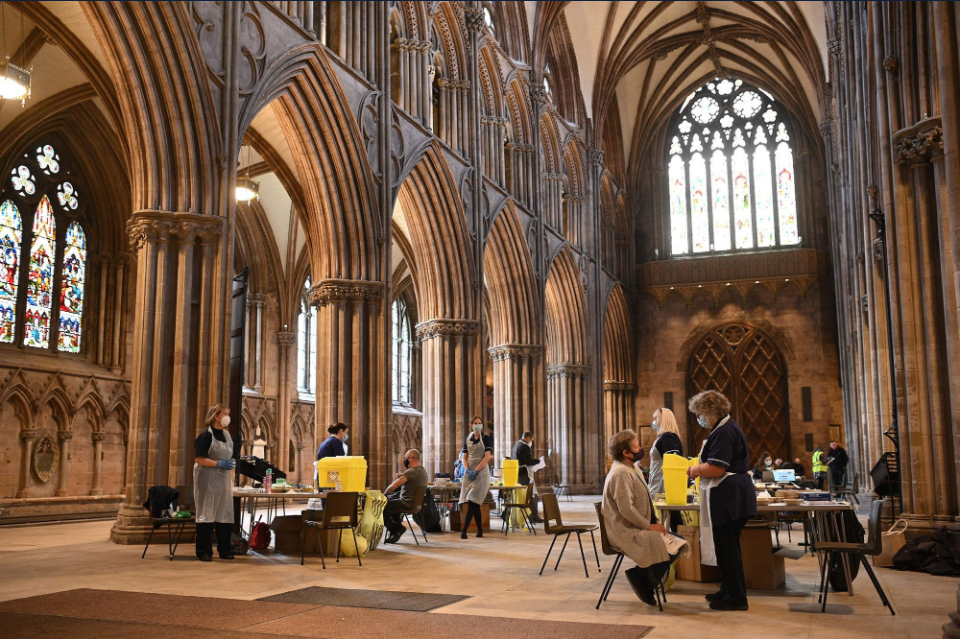 People get receive Oxford-AstraZeneca vaccine shots Thursday at Lichfield Cathedral in England, a temporary vaccination center.Oli Scarff / AFP - Getty Images