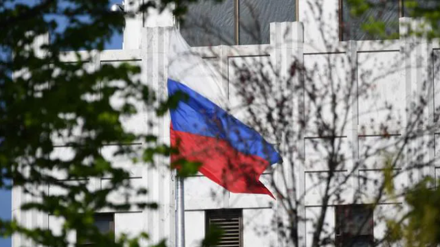 The Russian flag flies at the embassy's compound in Washington, DC, on April 15. Picture: Mandel NGAN / AFPSource:AFP