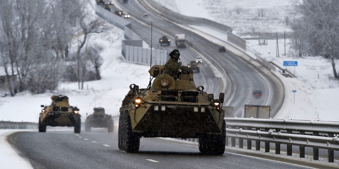 A convoy of Russian armored vehicles moves along a highway in Crimea January 18. Associated Press
