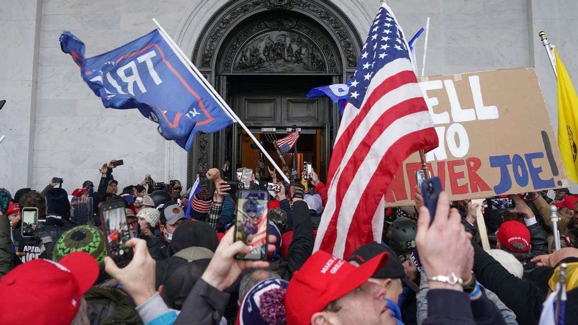 Rioters try to enter the U.S. Capitol on Jan. 6, 2021, in Washington. (AP Photo/John Minchillo) JOHN MINCHILLO AP