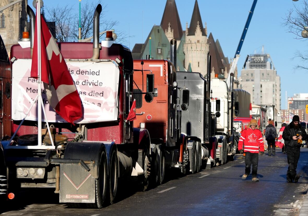 Wellington Street seen on Feb. 14 still lined with trucks, after city officials negotiated to move some trucks towards Parliament and away from downtown residences. (Justin Tang/The Canadian Press)