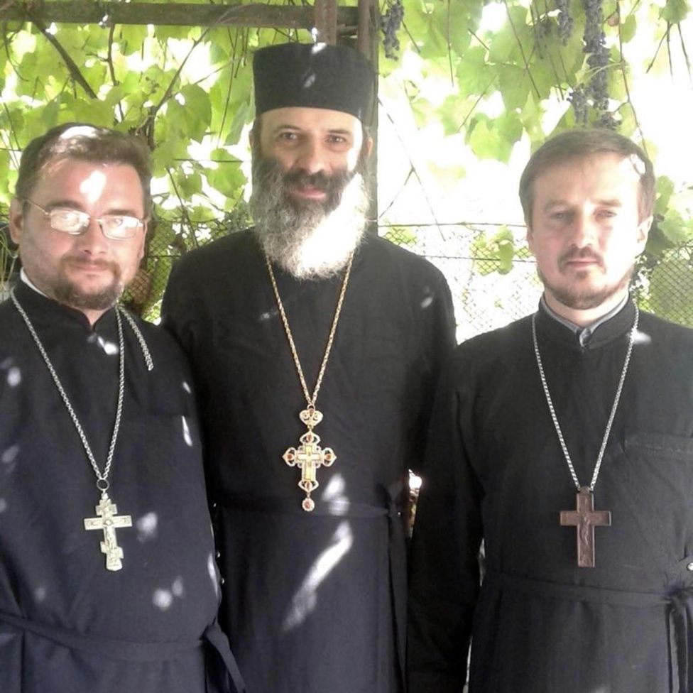 SERHII TSOMA  | Village priest Rostyslav Dudarenko (L) with fellow priests Pavlo Naydenov and Serhii Tsoma (R)