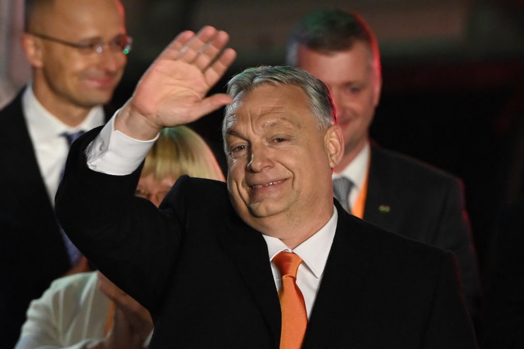 Hungarian Prime Minister Viktor Orban and members of the Fidesz party celebrate on stage at the 'Balna' building on the bank of the Danube River of Budapest, on April 3, 2022. Attila Kisbenedek—AFP/Getty Images