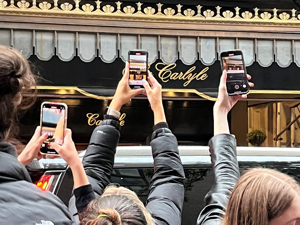 Phones at the ready outside The Carlyle. Picture: Benedict Brook