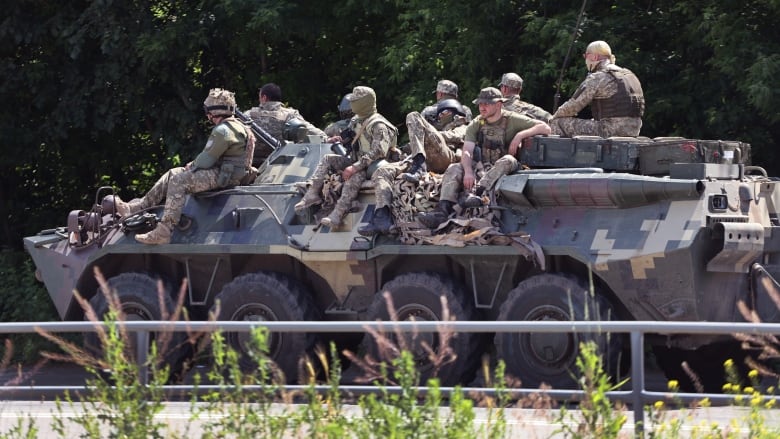 Ukrainian soldiers are seen near Druzhkivka, in Ukraine's eastern Donbas region, on Sunday. (Scott Olson/Getty Images)