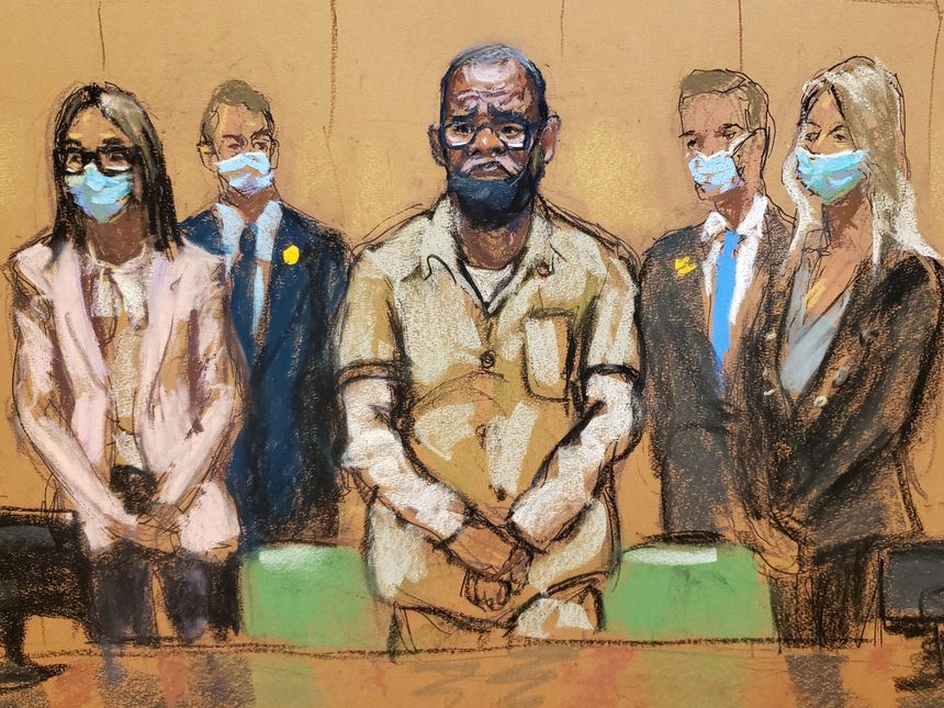 R. Kelly stands with his lawyers during his sentencing hearing Wednesday at the Brooklyn Federal Courthouse in New York. PHOTO: JANE ROSENBERG/REUTERS