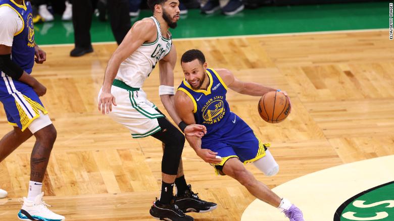 Warriors' Stephen Curry drives by Jayson Tatum of the Celtics during Game 6 Thursday night in Boston.