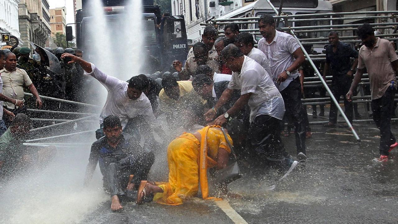 Police use water canon to disperse farmers taking part in an anti-government protest demanding the resignation of Sri Lanka's President Gotabaya Rajapaksa over the country's ongoing economic crisis in Colombo. Picture: AFP