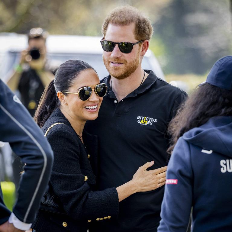 Prince Harry and his wife, Meghan Markle. (Photo by Remko de Waal / ANP / AFP)