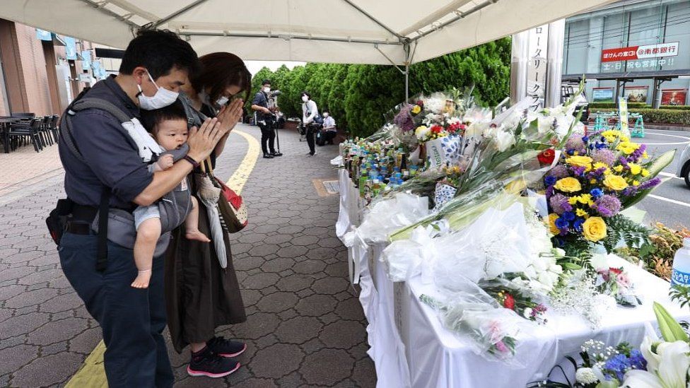 EPA / Mourners at the site of the assassination in Nara
