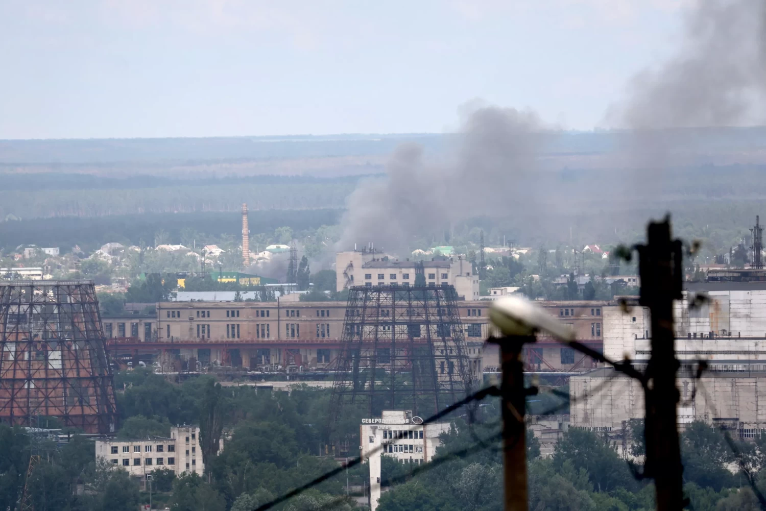 Smoke rises from Severodonetsk on June 16, 2022 in Lysychansk, Ukraine. SCOTT OLSON/GETTY IMAGES
