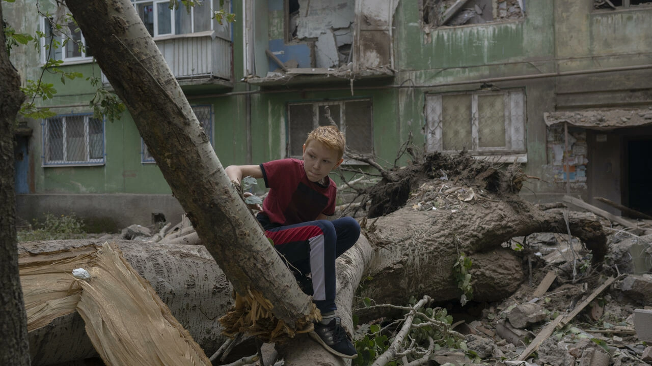 A boy sizes up the damage after a Russian strike in Kostiantynivka, eastern Ukraine Bulent KILIC AFP