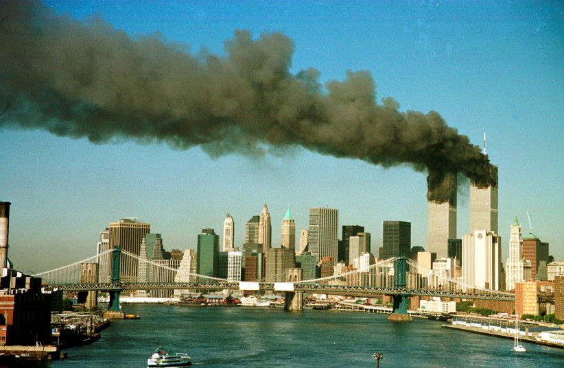 THE TWIN Towers burn (photo credit: Brad Rickerby/File/Reuters)