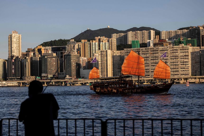 A junk boat sailed on Victoria Harbour in Hong Kong earlier this year. PHOTO: ISAAC LAWRENCE/AGENCE FRANCE-PRESSE/GETTY IMAGES