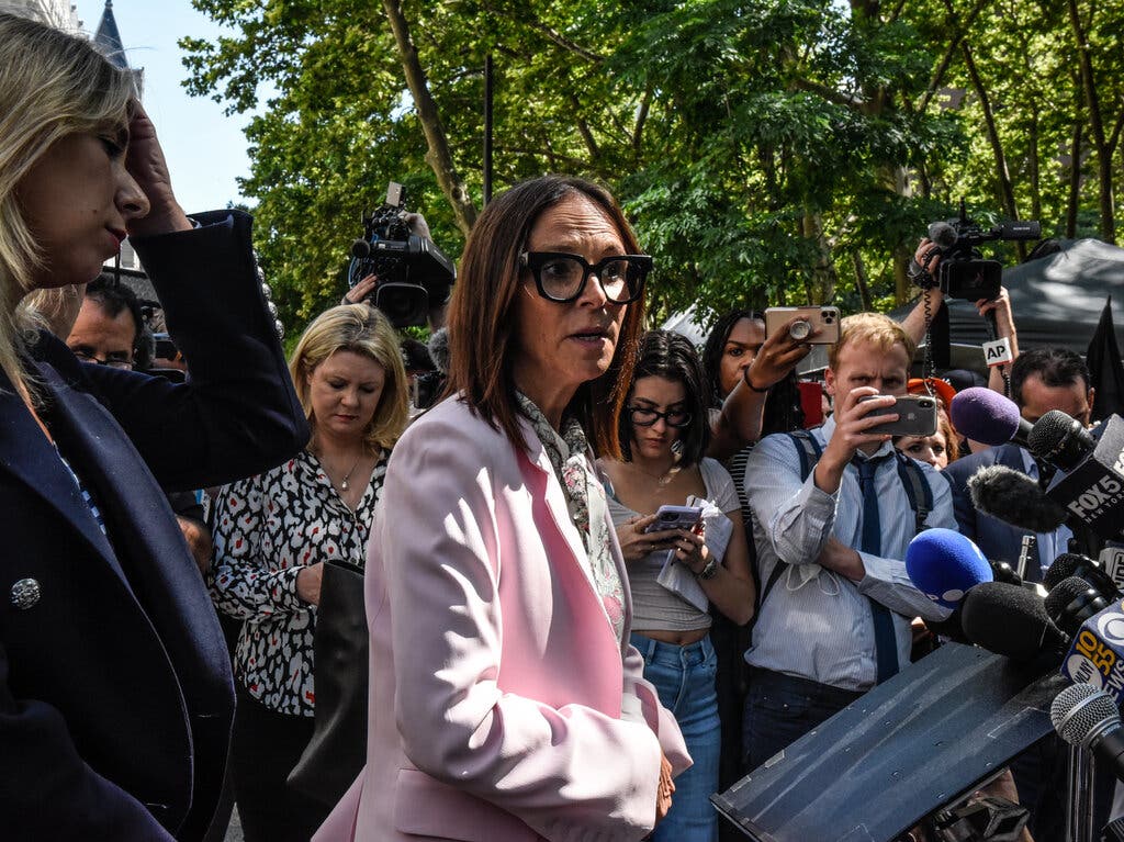 Jennifer Bonjean outside Brooklyn federal court in June, where R. Kelly was being sentenced after being convicted of racketeering and sex trafficking. Credit...Stephanie Keith for The New York Times