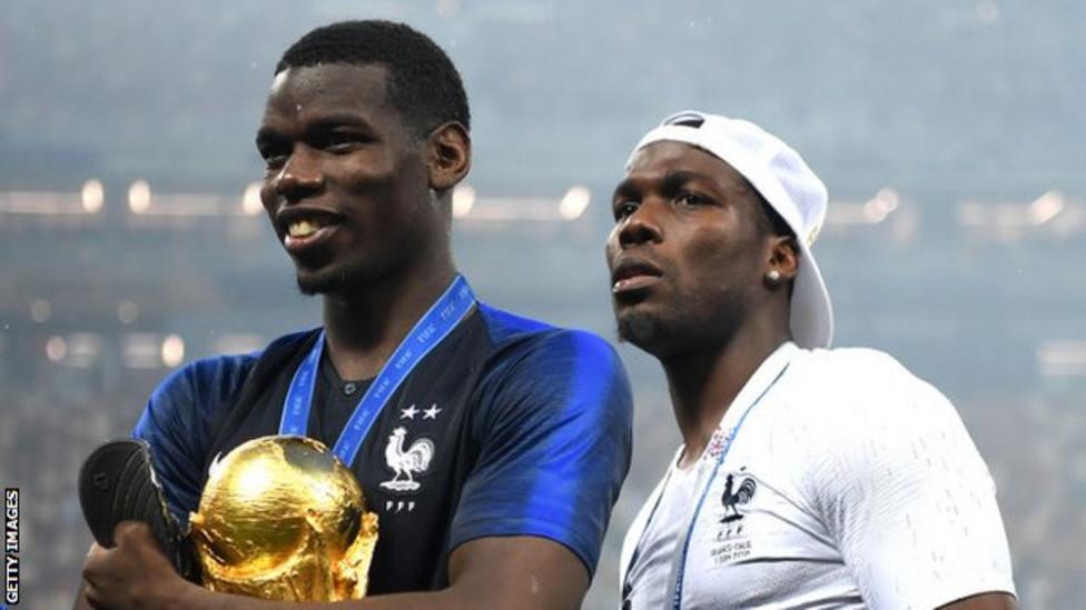 Mathias Pogba, right, joined brother Paul on the pitch to celebrate France's 2018 World Cup win / Getty Images