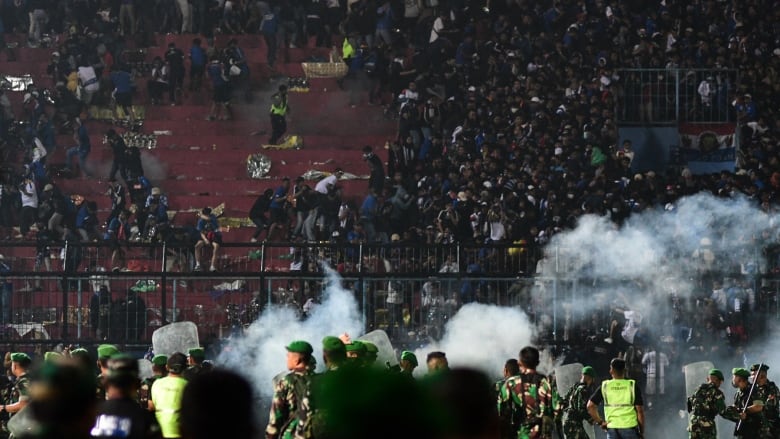 Soccer stadium crush in Indonesia leaves 125 dead as president orders investigation