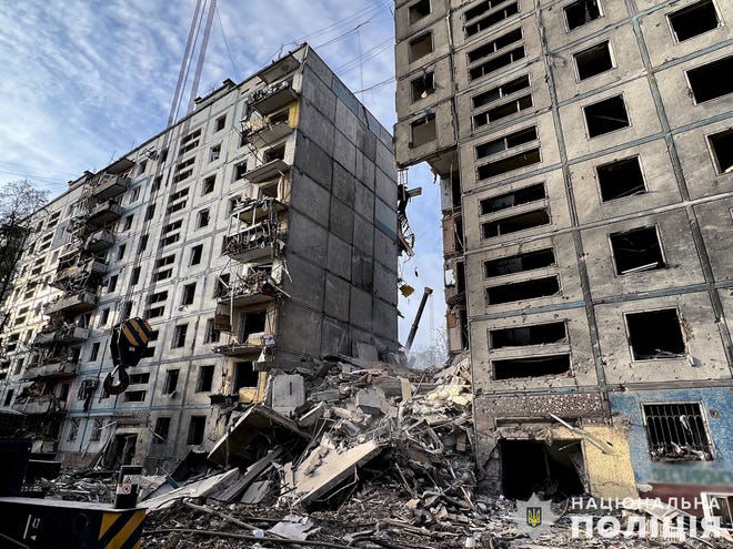 This handout picture taken and released by National Police of Ukraine on Oct. 9, 2022, shows a residential building after a strike in Zaporizhzhia, amid the Russian invasion of Ukraine.