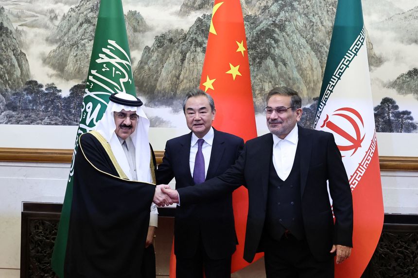 Wang Yi, China’s top diplomat, center, in Beijing on Friday with counterparts Musaad bin Mohammed Al Aiban of Saudi Arabia and Ali Shamkhani of Iran, in an image provided by China Daily. PHOTO: CHINA DAILY/REUTERS