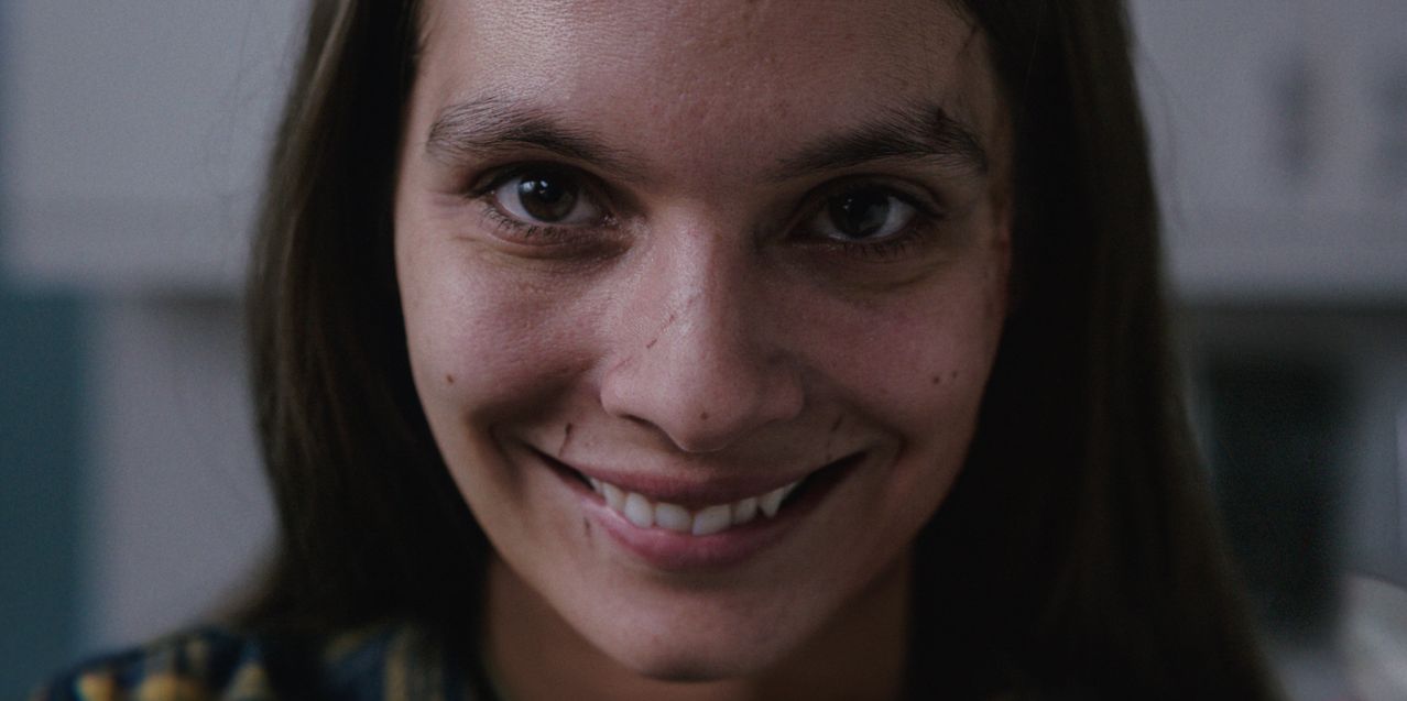 Caitlin Stasey, who plays Laura Weaver in ‘Smile’ a 2022 horror film about a woman terrorized by an entity that takes the form of smiling people . PARAMOUNT PICTURES/PARAMOUNT +