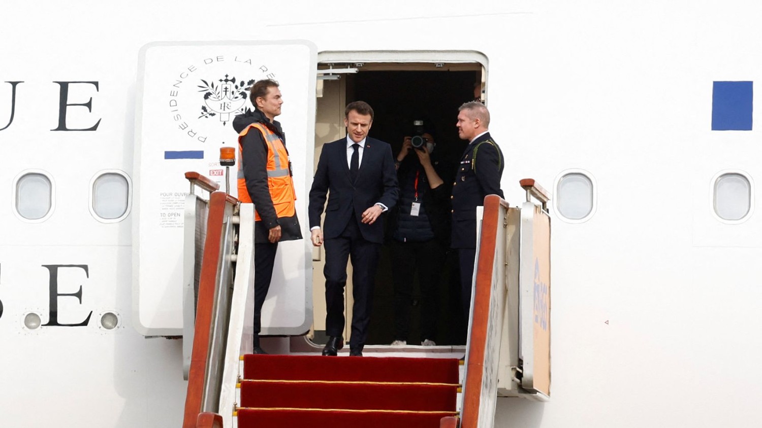 Gonzalo Fuentes/Reuters/French President Emmanuel Macron arrives at Beijing Capital International Airport on April 5, 2023.