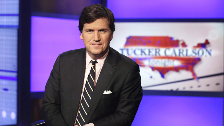 FILE PHOTO: Tucker Carlson, host of 'Tucker Carlson Tonight', poses for photos in a Fox News Channel studio. ©  AP Photo / Richard Drew