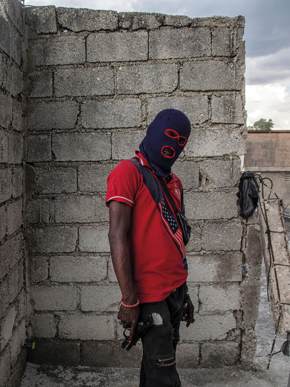 A gang member in the Portail Léogâne neighbourhood of Port-au-Prince. Photo by Rodrigo Abd / AP Photo